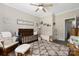Warm Bedroom with wood floors, ceiling fan, rocker, and crib, perfect for a growing Gathering at 326 Teeter Rd, Mooresville, NC 28115