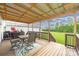 Spacious covered deck with table and chairs, perfect for outdoor dining and entertaining at 326 Teeter Rd, Mooresville, NC 28115