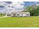 Charming single-story home with a covered porch, green lawn, and detached garage, providing ample space and curb appeal at 326 Teeter Rd, Mooresville, NC 28115