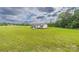 Sprawling lawn surrounds this charming home, offering plenty of space and privacy at 326 Teeter Rd, Mooresville, NC 28115