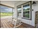 Inviting front porch with rocking chairs, perfect for relaxing and enjoying the peaceful surroundings at 326 Teeter Rd, Mooresville, NC 28115