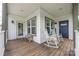 Welcoming front porch with rocking chairs and ample space for enjoying the outdoors at 326 Teeter Rd, Mooresville, NC 28115