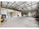 Spacious garage featuring high ceilings, storage cabinets, and ample room for vehicles and projects at 326 Teeter Rd, Mooresville, NC 28115