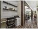 Comfortable home office with modern desk, custom shelving, and views into the living area at 326 Teeter Rd, Mooresville, NC 28115