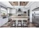 Bright, well-appointed kitchen with white cabinetry, wood countertops, stainless steel appliances, and a large center island at 326 Teeter Rd, Mooresville, NC 28115