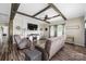 Inviting living room with wood beam ceiling, comfortable seating, modern TV setup, and stylish decor at 326 Teeter Rd, Mooresville, NC 28115