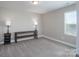 Clean and well-lit bedroom with soft neutral colors, carpet, natural lighting and simple furnishings at 4117 Sunset Ridge Dr, Rock Hill, SC 29732