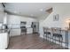 Bright kitchen boasts stainless appliances, granite counters, white subway tile backsplash and hardwood floors at 4117 Sunset Ridge Dr, Rock Hill, SC 29732