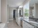 Bright bathroom featuring double sinks with granite countertops, tile floor, walk-in closet, and walk-in shower at 4117 Sunset Ridge Dr, Rock Hill, SC 29732