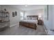 Spacious main bedroom showcases wood furniture, soft neutral colors, carpet, and natural lighting at 4117 Sunset Ridge Dr, Rock Hill, SC 29732