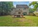Expansive backyard with a well-maintained lawn and a wooden deck perfect for outdoor gatherings at 4502 Magnolia Ridge Dr, Waxhaw, NC 28173