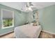 This bedroom features a ceiling fan, neutral walls and large window at 4502 Magnolia Ridge Dr, Waxhaw, NC 28173