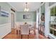 Bright dining room with wainscoting, chandelier, and natural light from the large window at 4502 Magnolia Ridge Dr, Waxhaw, NC 28173