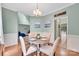 Bright dining room with table and four chairs with a view of another living space at 4502 Magnolia Ridge Dr, Waxhaw, NC 28173