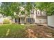 Charming two-story home with a well-manicured lawn and inviting front porch at 4502 Magnolia Ridge Dr, Waxhaw, NC 28173