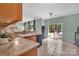 A bright kitchen area with granite countertops, tile floors, and backyard access at 4502 Magnolia Ridge Dr, Waxhaw, NC 28173