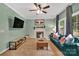 Cozy living room featuring a ceiling fan, fireplace, and comfortable seating at 4502 Magnolia Ridge Dr, Waxhaw, NC 28173