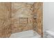 Close-up of the shower featuring ceramic tile and a shower niche at 4533 Gainesborough Rd, Charlotte, NC 28205