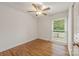 Bedroom featuring beautiful hardwood floors and a large window at 4533 Gainesborough Rd, Charlotte, NC 28205