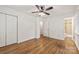 Bedroom with wood floors and a closet leading to a bathroom at 4533 Gainesborough Rd, Charlotte, NC 28205
