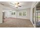 Open living area connected to kitchen, featuring new carpet and ample natural light at 4533 Gainesborough Rd, Charlotte, NC 28205