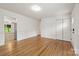 Open-concept living area featuring hardwood floors and neutral wall colors at 4533 Gainesborough Rd, Charlotte, NC 28205