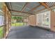 Enclosed patio with screen and views of the exterior yard at 4533 Gainesborough Rd, Charlotte, NC 28205