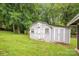 The shed features painted wood construction and double doors at 4533 Gainesborough Rd, Charlotte, NC 28205