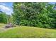 The spacious backyard is perfect for outdoor entertaining with mature trees at 4916 Oak Pasture Ln, Charlotte, NC 28269