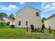 Exterior backyard view with chairs, grassy area, and the home's exterior at 4916 Oak Pasture Ln, Charlotte, NC 28269