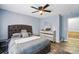 Bedroom with grey tufted bed and matching furniture at 4916 Oak Pasture Ln, Charlotte, NC 28269