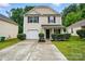 Charming two-story home featuring a garage, manicured landscaping, and a welcoming front entrance at 4916 Oak Pasture Ln, Charlotte, NC 28269