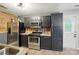 Kitchen featuring stainless steel appliances, wooden back splash, and modern fixtures at 4916 Oak Pasture Ln, Charlotte, NC 28269