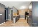 Functional kitchen featuring wooden back splash, stainless steel appliances, and ample cabinet space at 4916 Oak Pasture Ln, Charlotte, NC 28269