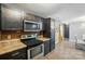 Kitchen featuring stainless steel oven and microwave with view of dining room at 4916 Oak Pasture Ln, Charlotte, NC 28269