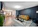 Stylish living room boasts hardwood floors, modern lighting, and contemporary decor with lots of open space at 4916 Oak Pasture Ln, Charlotte, NC 28269