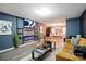 Stylish living room boasts hardwood floors, modern lighting, and contemporary decor with lots of open space at 4916 Oak Pasture Ln, Charlotte, NC 28269