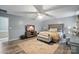 Spacious main bedroom featuring a king bed, modern ceiling fan, and flat screen television at 4916 Oak Pasture Ln, Charlotte, NC 28269