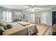 Spacious main bedroom featuring a king bed, modern ceiling fan, and neutral color palette at 4916 Oak Pasture Ln, Charlotte, NC 28269
