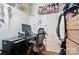 Small home office featuring a black desk, desk chair, computer, and storage shelving at 4916 Oak Pasture Ln, Charlotte, NC 28269