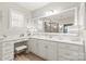 Bright bathroom featuring a large mirror, vanity area, and white cabinetry at 5002 Samoa Ridge Dr, Lancaster, SC 29270