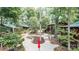 Aerial view of a community featuring charming cabins, winding walkways, and lush landscaping at 5002 Samoa Ridge Dr, Lancaster, SC 29270