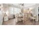 Elegant dining room featuring a round table, shuttered windows, and stylish decor at 5002 Samoa Ridge Dr, Lancaster, SC 29270