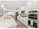 White kitchen featuring stainless steel appliances, double oven, and an island with pendant lighting at 5002 Samoa Ridge Dr, Lancaster, SC 29270