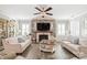 Inviting living room featuring a stone fireplace, plush sofas, and elegant decor for comfortable living at 5002 Samoa Ridge Dr, Lancaster, SC 29270