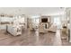 Open-concept living space featuring a modern kitchen, cozy living room, and stylish decor at 5002 Samoa Ridge Dr, Lancaster, SC 29270