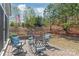 Relaxing outdoor patio with comfortable seating and a beautifully landscaped backyard at 5002 Samoa Ridge Dr, Lancaster, SC 29270