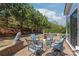 Cozy outdoor brick patio with comfortable seating and a serene view of the treelined backyard at 5002 Samoa Ridge Dr, Lancaster, SC 29270