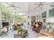 Inviting sunroom with glass windows, comfortable seating arrangements, and lots of light at 5002 Samoa Ridge Dr, Lancaster, SC 29270