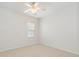 Neutral carpeted bedroom with a ceiling fan and window at 5306 Prosperity View Dr, Charlotte, NC 28269